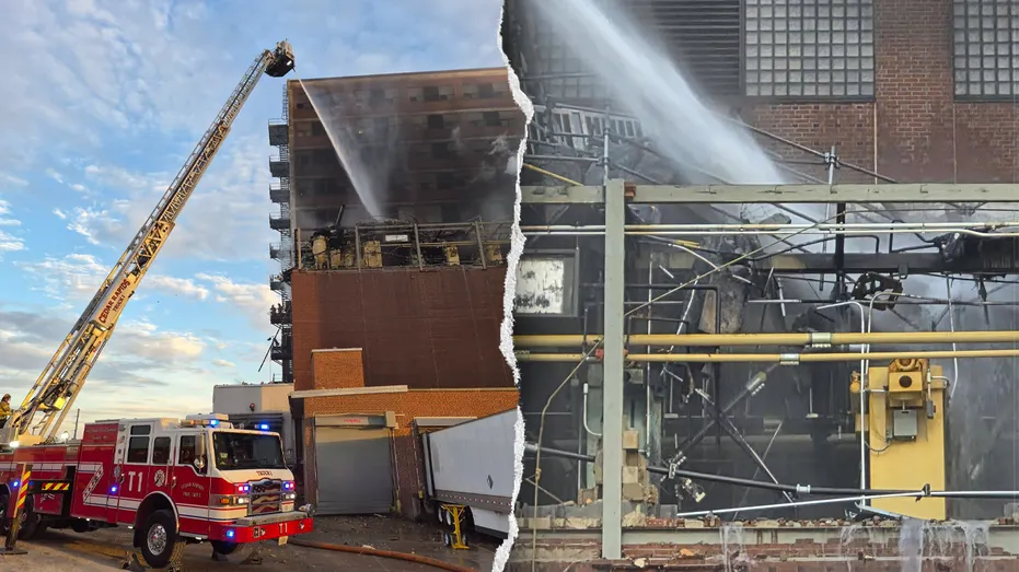 Firefighters work near a plant after an explosion and fire.