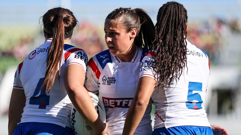 England's Jenna Foubister congratulates Connie Boyd on her try against Wales
