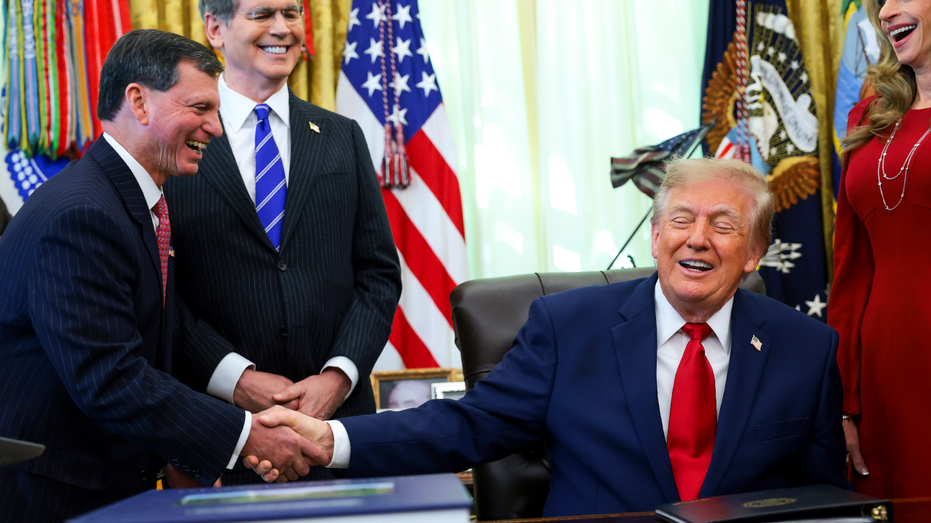 Social Security Administration Commissioner Frank Bisignano shakes hands with U.S. President Donald Trump