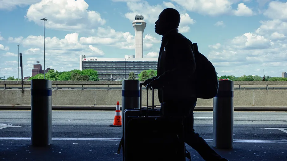 Newark Airport tower with passenger