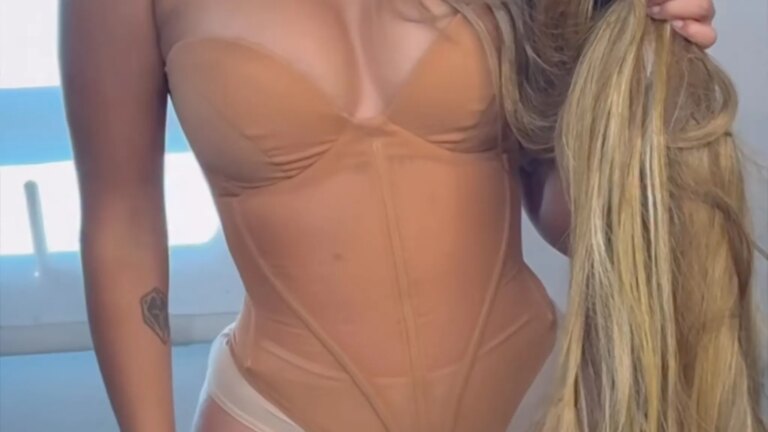 Guess The Sexy Singer In This Skin-Tight Corset!