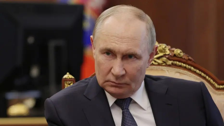 Russian President Vladimir Putin listens during a meeting at the Kremlin