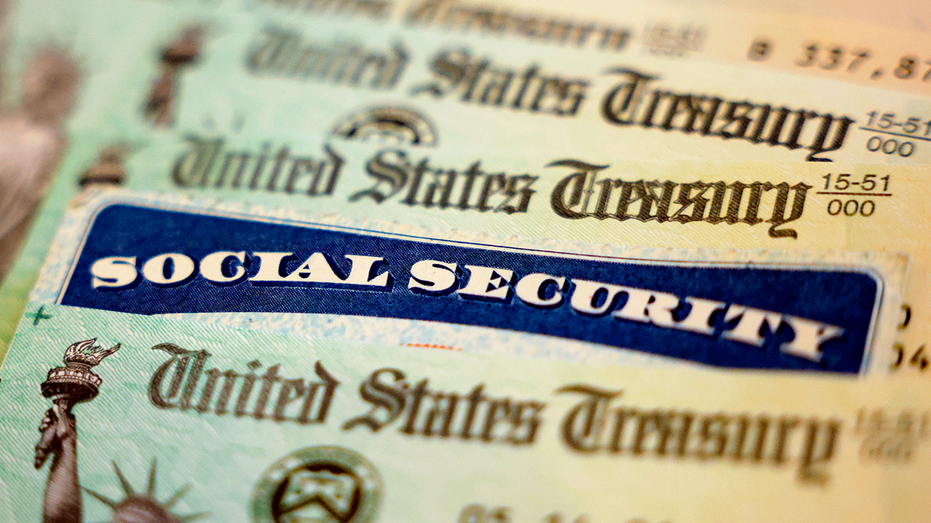 Social Security card sits alongside checks from the U.S. Treasury
