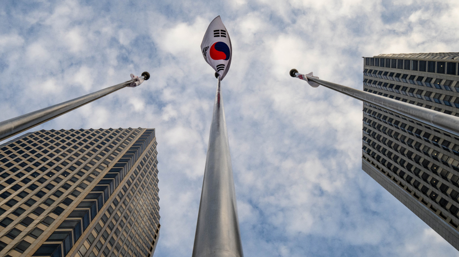 The national flag of South Korea flutters in the wind outside the LG Group's Twin Tower buildings in Seoul