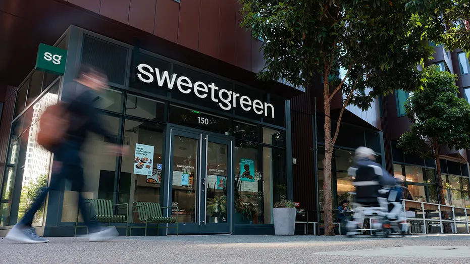 Pedestrians pass by a Sweetgreen restaurant